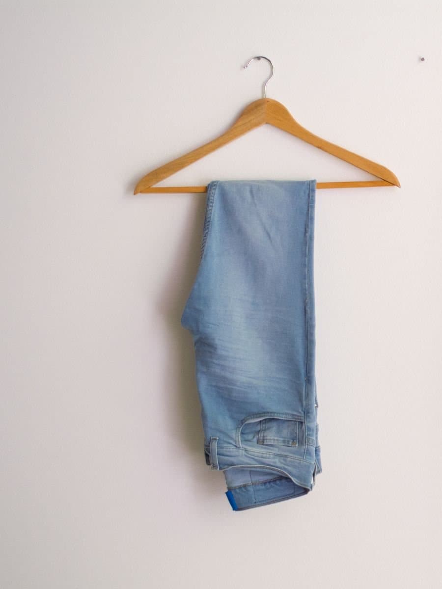 The uploaded garment photo: light-wash jeans